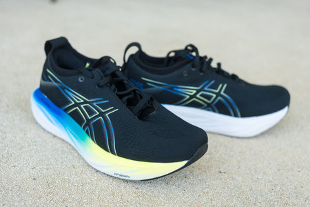 Bangkok, Thailand - January 25, 2024 : A pair of ASICS Running Shoes Gel Nimbus 25 WIDE. Asics is a Japanese multinational corporation which produces sports equipmentのeditorial素材