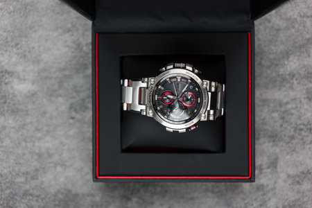 Bangkok, Thailand - January 25, 2024 : G-SHOCK watch model MTG-B1000D-1ADR model, an elegance and luxurious watch, stands out with a metallic red color.のeditorial素材
