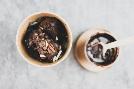 Dark chocolate and almond butter brownies with chocolate chip in brown boxの写真素材
