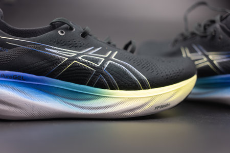 Bangkok, Thailand - January 31, 2024 : New asics sneakers, ASICS Running Shoes Gel Nimbus 25 WIDE with good stability on black backgroundのeditorial素材
