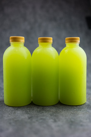 Close up shot of three tasty healthy guava juice bottles with no brand for commercial advertisement text.の写真素材