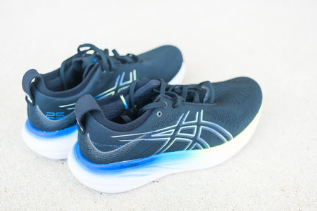 Bangkok, Thailand - February 3, 2024 : A pair of ASICS Running Shoes Gel Nimbus 25 WIDE. Asics is a Japanese multinational corporation which produces sports equipmentのeditorial素材