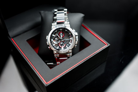 Bangkok, Thailand - February 5, 2024 : G-SHOCK watch model MTG-B1000D-1ADR, an elegance and luxurious watch, stands out with a metallic red color.のeditorial素材