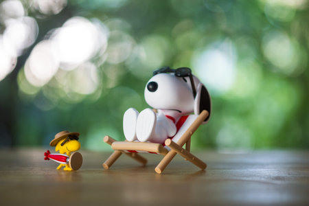 BANGKOK, THAILAND - FEBRUARY 5, 2024 : Snoopy Sunbathing. Snoopy the Best Friends series figures, a size height about 10cm.のeditorial素材