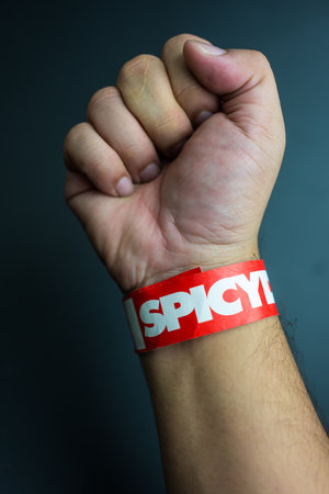 Bangkok, Thailand - February 5, 2024 : A red of wristband from spicydisc. The spicydisc is is a music label in Thailand and famous at Thailandのeditorial素材