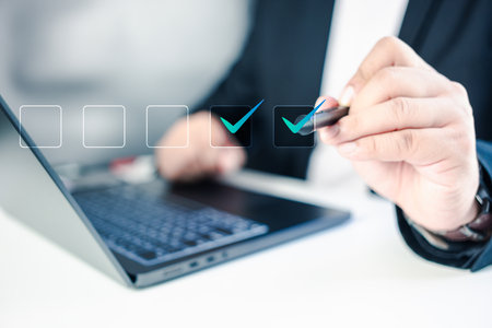 Document checklist online organizational leadership for business in organization performance. Checklist concept, Businessman checking mark on the check boxesの写真素材