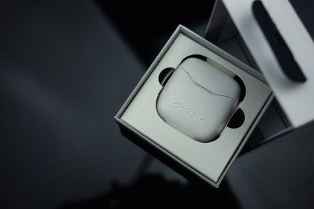 Bangkok, Thailand - February 14, 2024 : Earphones Defunc wireless headphones TRUE BASIC model with case for charging. The newest wireless earbudsのeditorial素材