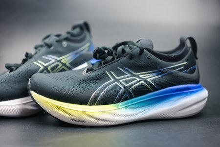 Bangkok, Thailand - February 16, 2024 : ASICS Running Shoes Gel Nimbus 25 WIDE. Asics is a Japanese multinational corporation which produces sports equipment designed for a wide range of sports.のeditorial素材