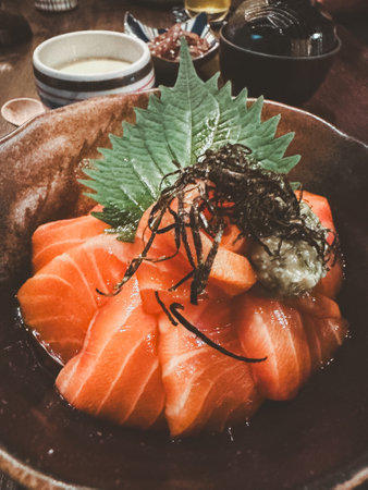 Japanese rice with fresh salmon slice sashimi. Take a photo by smartphoneの写真素材