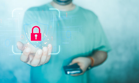 Male hand holding a lock padlock icon. Cyber security network. Internet technology networking.Protecting data personal information. Data protection privacy concept. PDPA conceptの写真素材