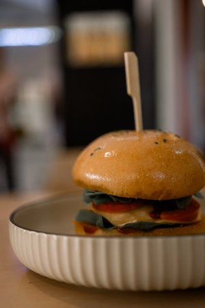 Delicious pork burger with cheese in fast food cafeの写真素材