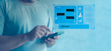 Man working with phone and chatbot that helps in education and work. Smart AI technology and social network icons. Concept of virtual assistant and artificial intelligenceの写真素材