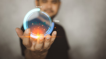Hand shows the sign of virtual progress for increasing value added. Man is pulling up circle progress bar with the word VALUE. Increasing value concept. Profit, benefit growth and developmentの写真素材