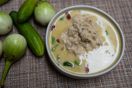 Fermented fish spicy dip served with fresh green eggplant and cucumber. Thai foodの写真素材