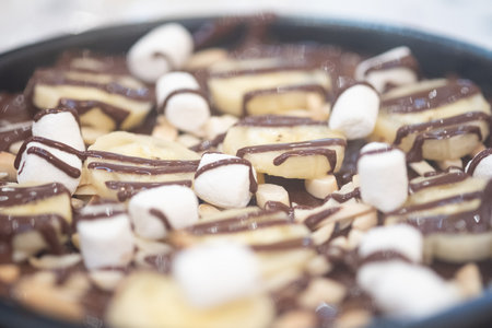 Slice of banana and marshmallow with chocolate. Close upの写真素材