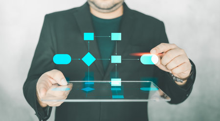 Business process flowchart, implement and improve analysis for process and workflow automation with flowchart, a businessman in background. Process and flowchart. Network technology and data.の写真素材