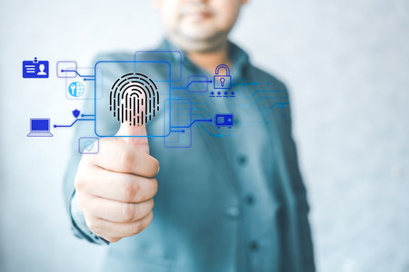 Businessman using fingerprint identification to access personal data. The concept of E-kyc (electronic know your customer), biometrics security, innovation technology against digital cyber crimeの写真素材