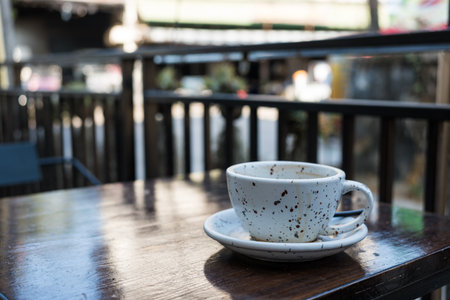 Empty cup coffee after drink placed on the table in a coffee shop, side view