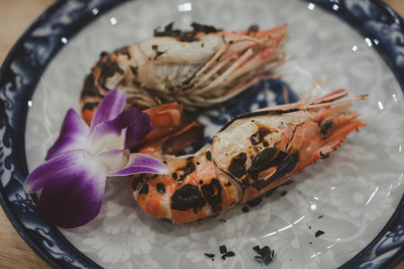 Grilled river shrimp or Thai shrimp. Flame grilled prawns on platesの写真素材