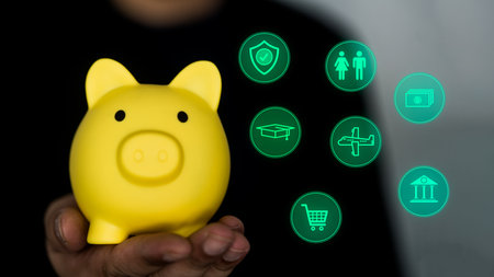 Hand holding a piggy bank and planning money icons. Concept of savings, investments, returns, interest, finance and banking. Value of growth in financial success.の写真素材