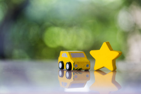 Wood car and wood star for scoring satisfaction surveys, the best service warranty concept.の写真素材