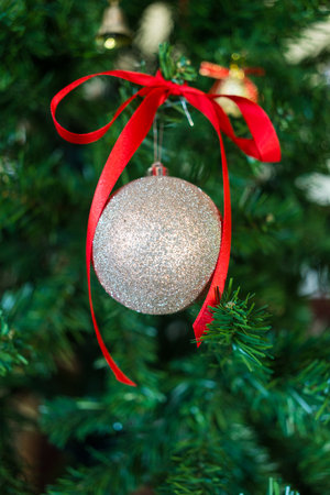 Close up Christmas decoration silver balls on a branchの写真素材