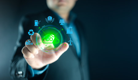 Concept of environmental, Green ethical business preserving resources, reducing CO2. Businessman hand pointing on screen CO2 icon. Businesses carbon credits sustainable development goalsの写真素材