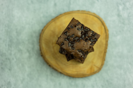 Dark chocolate brownies topping with chocolate chips. Shot from aboveの写真素材