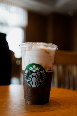 Bangkok, Thailand - May 10, 2024 : A glass of Starbucks coffee, Cold foam iced espresso, Shaken espresso, poured through creamy nonfat milk cold foam.のeditorial素材