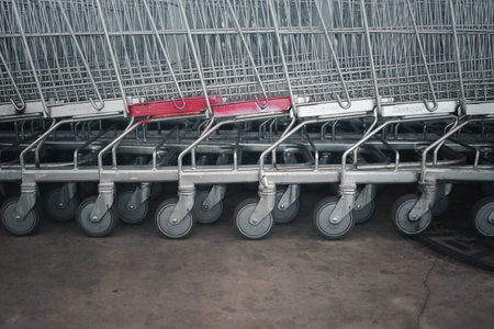 Close-up of a row shopping cart wheels. Concept of shoppingの写真素材