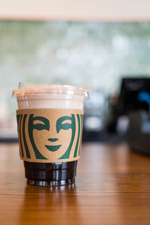 Samut Prakan, Thailand - May 21, 2024 : A glass of Starbucks Cold foam iced espresso on wood tableのeditorial素材