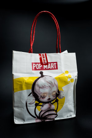 Bangkok, Thailand - June 5, 2024 : White paper shopping bag from POP MART. POP MART is the largest and fastest growing pop-toy maker in China.のeditorial素材