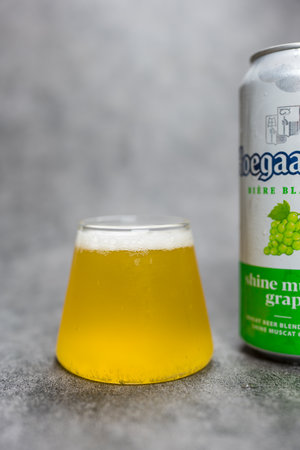 Samut Prakan, Thailand - May 26, 2024 : Can and glass of Belgian Hoegaarden Shine Muscat Grape, new flavor in Thailand.のeditorial素材