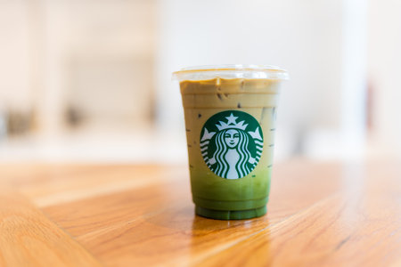 Bangkok, Thailand - June 6, 2024 : The fabulous drink that from Starbucks, Matcha Espresso or Espresso Matcha Fusion on wood table at Starbucks cafe coffee shopのeditorial素材