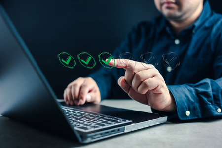 Business performance checklist concept, businessman using laptop doing online checklist survey, fill out digital form checklist. Checklist process order. Verify task detail tick markの写真素材