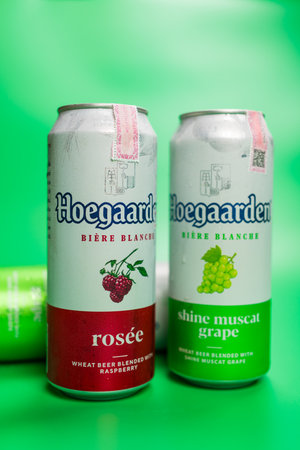 BANGKOK, THAILAND - JUNE 16, 2024 : A can of Hoegaarden Rosee Belgium beer and a cand of Hoegaarden Shine Muscat Grapeのeditorial素材