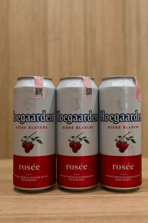 BANGKOK, THAILAND - JUNE 23, 2024 : A row can of Hoegaarden Rosee, a well-known wheat beer from Belgiumのeditorial素材