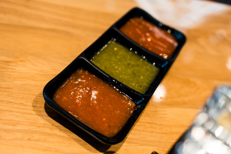 Shabu hot pot dipping sauce place on wood table