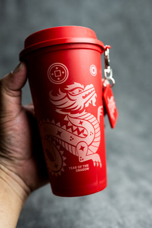 Bangkok, Thailand - June 24, 2024 : A red reusable cup from Cafe Amazon, Get power to enhance your luck with cup name of Dragon pattern. Get 1 free Dragon Reusable Cup in June 24, 2024のeditorial素材