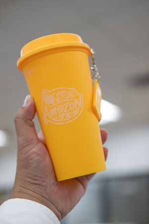 Bangkok, Thailand - June 25, 2024 : A red yellow reusable cup from Cafe Amazon, Get power to enhance your luck with cup name of Dragon pattern. Get 1 free Dragon Reusable Cup in June 25, 2024のeditorial素材