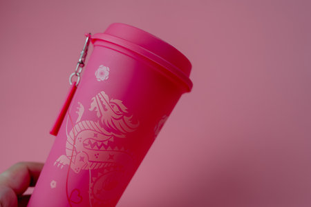 Bangkok, Thailand - June 26, 2024 : A pink reusable cup from Cafe Amazon, Get power to enhance your luck with cup name of Dragon pattern. Get 1 free Dragon Reusable Cup in June 25, 2024のeditorial素材