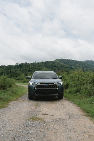 Bangkok, Thailand - June 26, 2024 : Private new Toyota corolla CROSS, Celestite gray metallic with forest and mountains backgroundのeditorial素材
