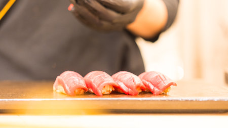 Japanese Omakase chef making Chutoro Sushi neatly by hands. Japanese traditional and luxury meal.の写真素材