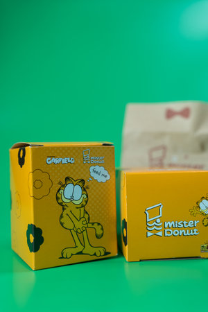 Bangkok, Thailand - July 30, 2024 : A box of Garfield art toy collection form Mister Donut, a popular cartoon.のeditorial素材