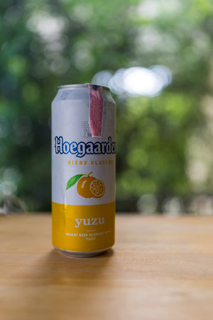 Bangkok, Thailand - June 25, 2024 : A can of beer Hoegaarden aluminum can with yuzu flavor on wood tableのeditorial素材