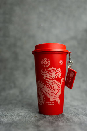 Bangkok, Thailand - June 24, 2024 : A red reusable cup from Cafe Amazon, Get power to enhance your luck with cup name of Dragon pattern. Get 1 free Dragon Reusable Cup in June 24, 2024のeditorial素材