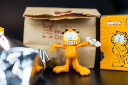 Bangkok, Thailand - July 5, 2024 : Mister Donut x Garfield. A cut toy of Garfield art toy collection, a popular cartoon.のeditorial素材