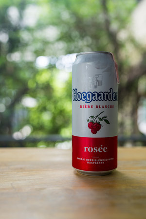Samut Prakan, Thailand - July 5, 2024 : A can of Hoegaarden rosee flavored on wood tableのeditorial素材