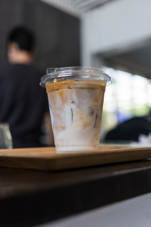 Iced latte coffee on plastic glass glass