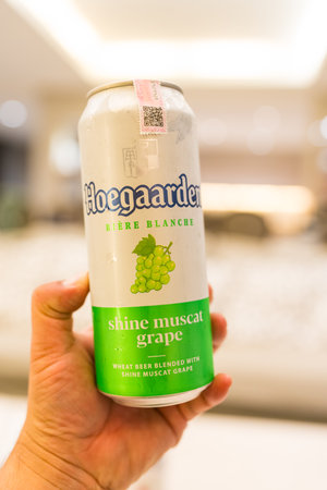 Bangkok, Thailand - July 19, 2024 : A can of Hoegaarden Shine Muscat Grape Belgium beer 500 ml size on hand at homeのeditorial素材